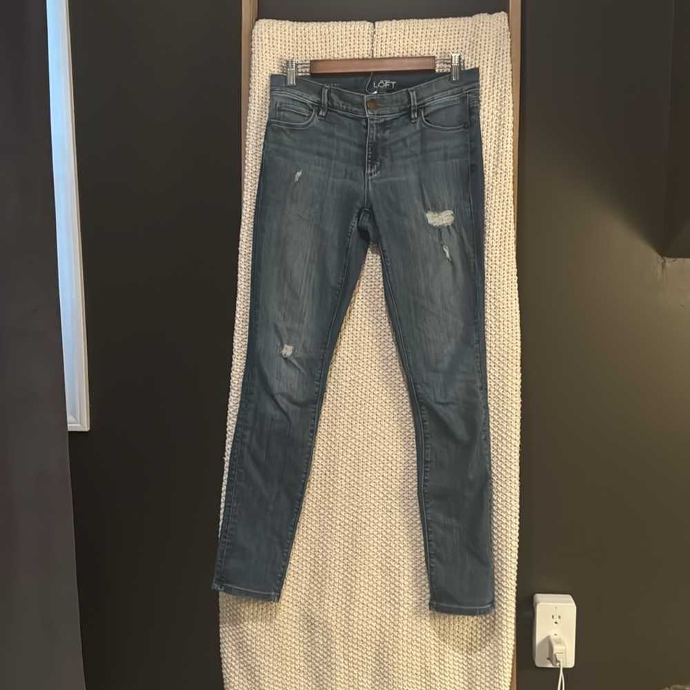 The Loft medium wash distressed modern jean size 27.